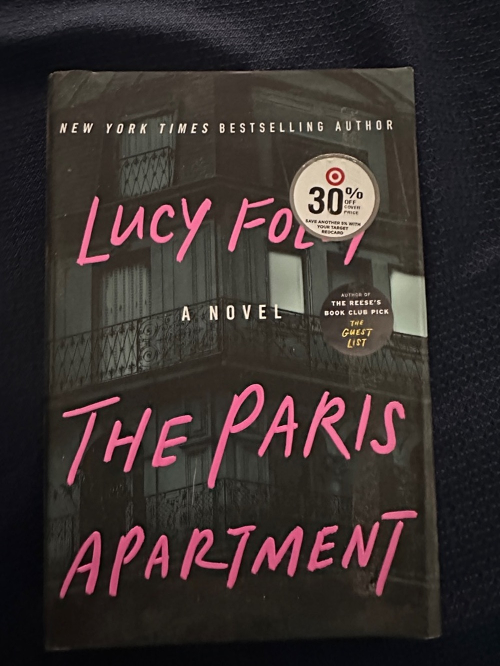 The Paris Apartment by Lucy Foley - Black Cover with Pink Title